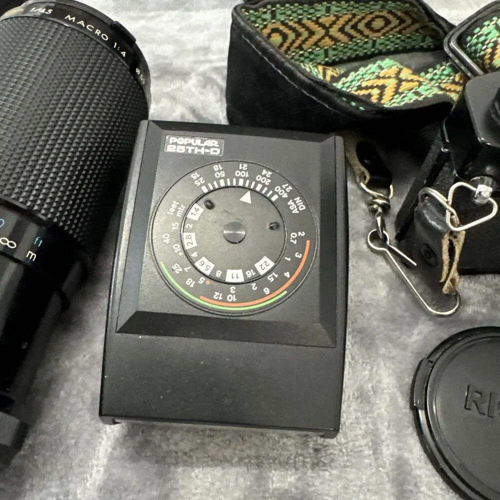 Ricoh KR-5 Film camera with lenses, flash, lens case, and camera bag.tested